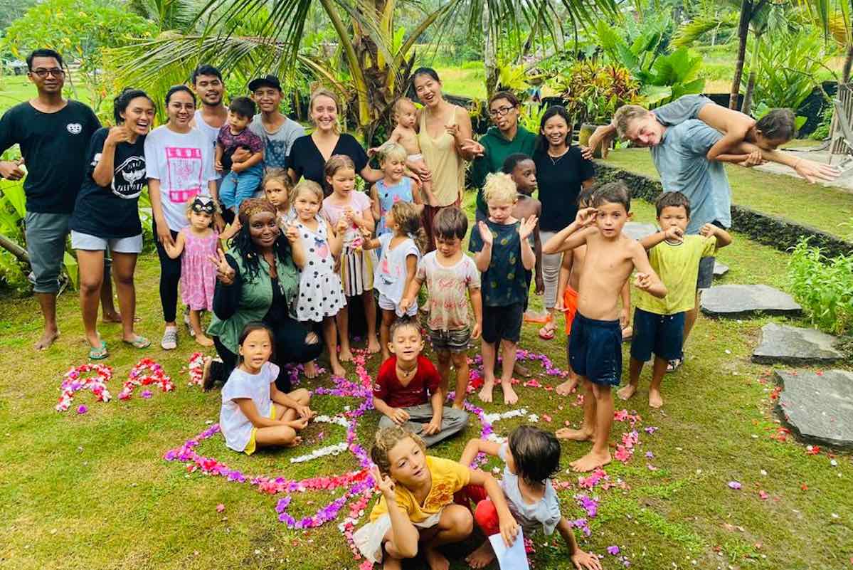 Children and adults gathered outdoors at Empathy School Bali.